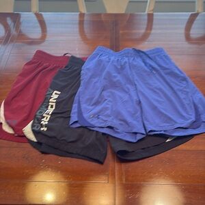 Three pairs of Under Armour men’s shorts.